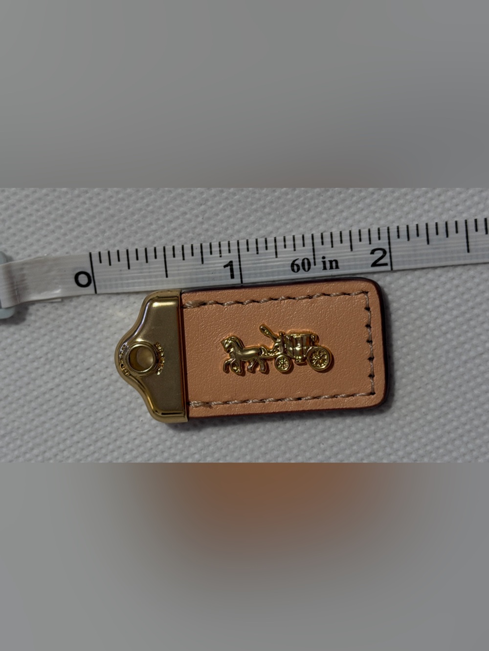 Coach Leather hanging tag bag charm with Gold-Tone Coach Carriage Accent